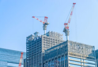 Crane construction building with blue sky background