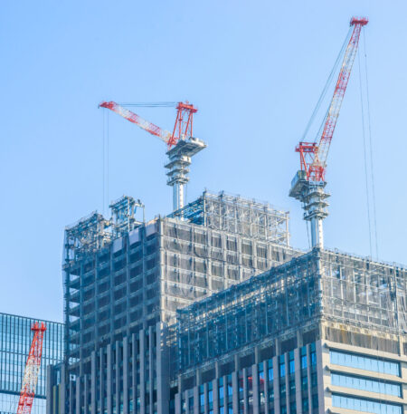 Crane construction building with blue sky background